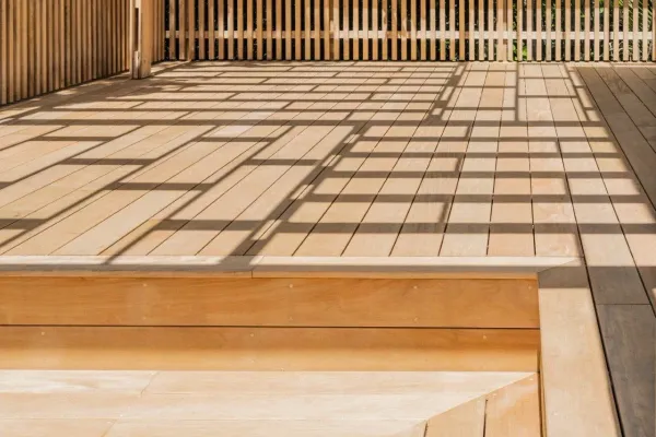 Showing the unique shadows that the pergola throws onto the timber deck