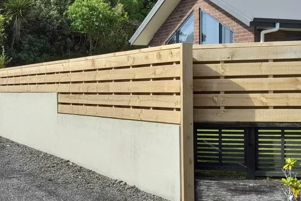 Timber fence to heighten wall