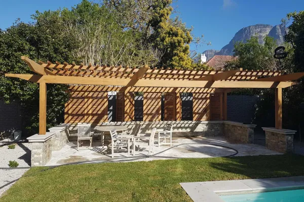 Pergola shade next to pool area