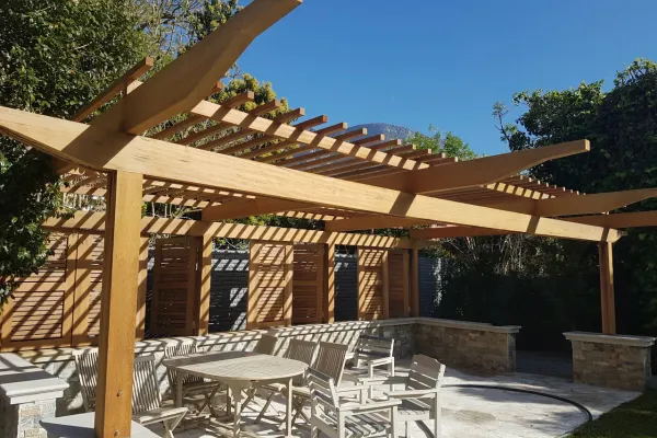 Timber pergola on white house