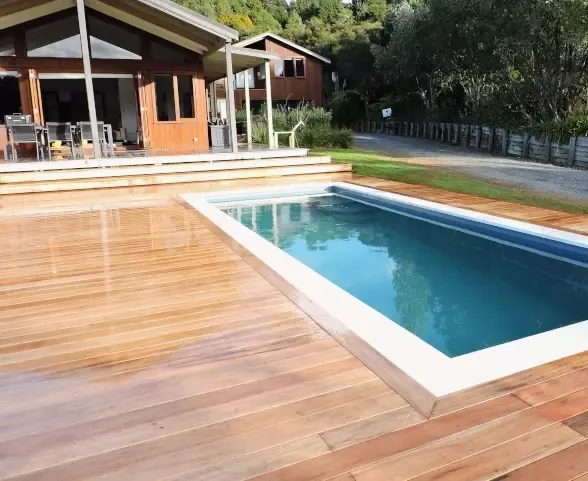 Timber deck built around a pool in Howick, East Auckland