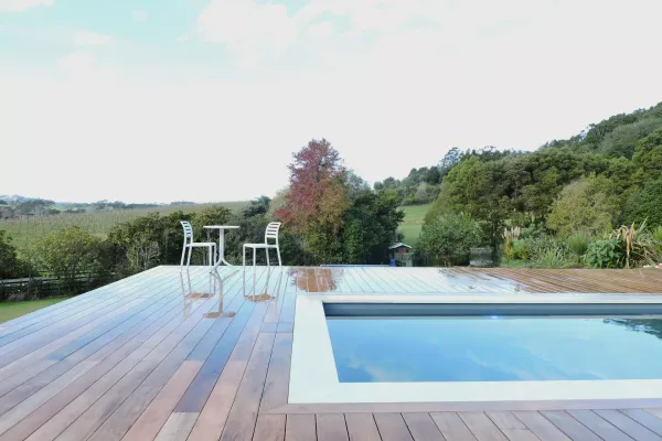 A deck built around a pool
