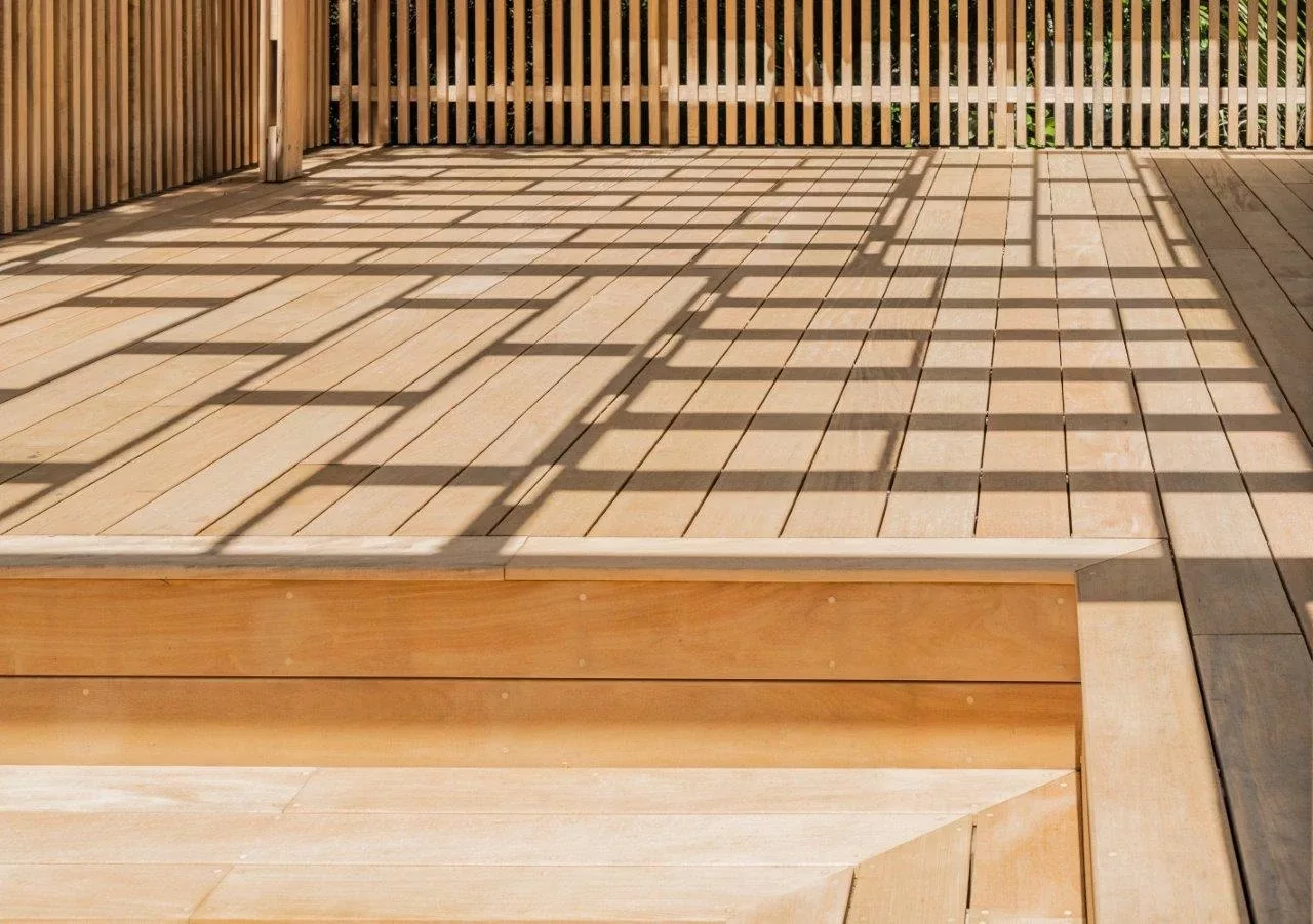 Showing the unique shadows that the pergola throws onto the timber deck