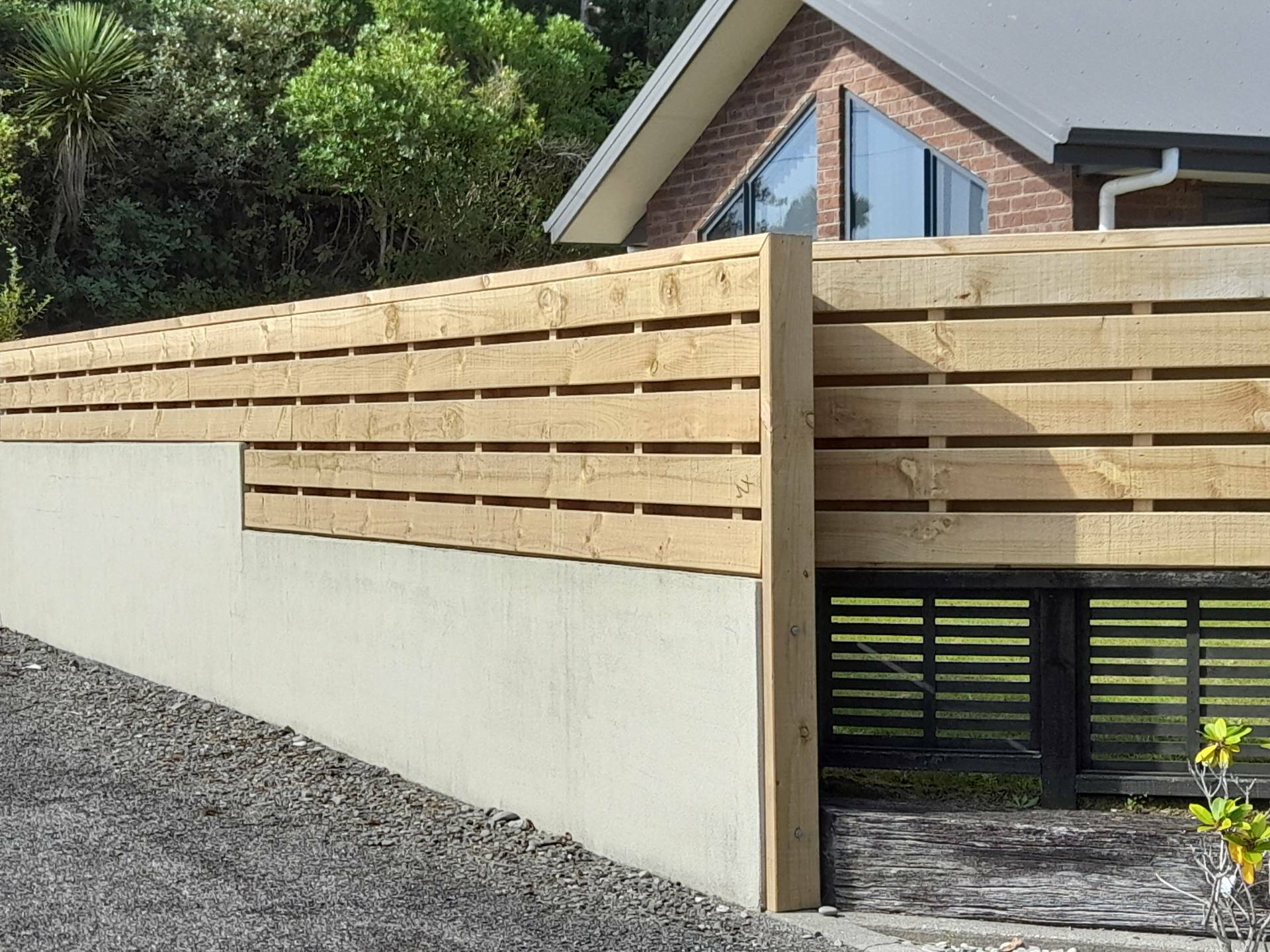 Timber fence to heighten wall